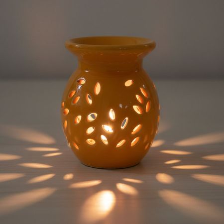 Pomarańczowy kominek zapachowy